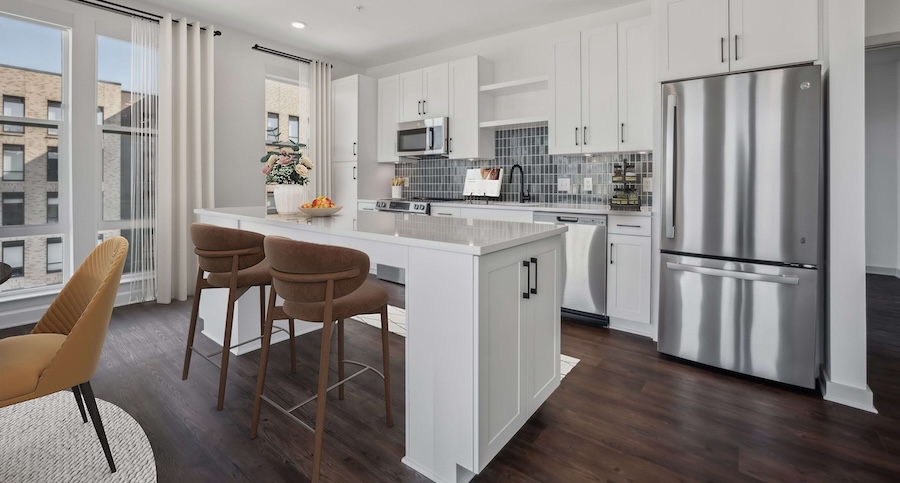 a large kitchen space with island seating