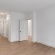 Living space with natural light and an open entryway and light-colored flooring