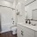 bathroom with sink mirror toilet and shower