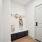 entrance to room with a hat and jacket hanging up