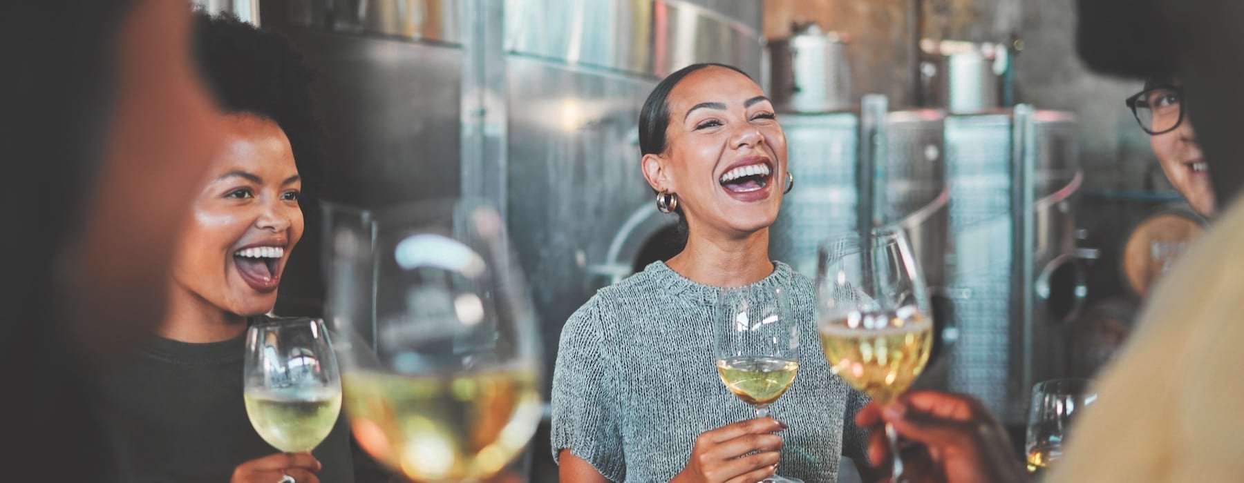 friends laughing and having drinks