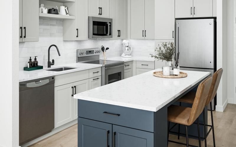 a kitchen with white cabinets