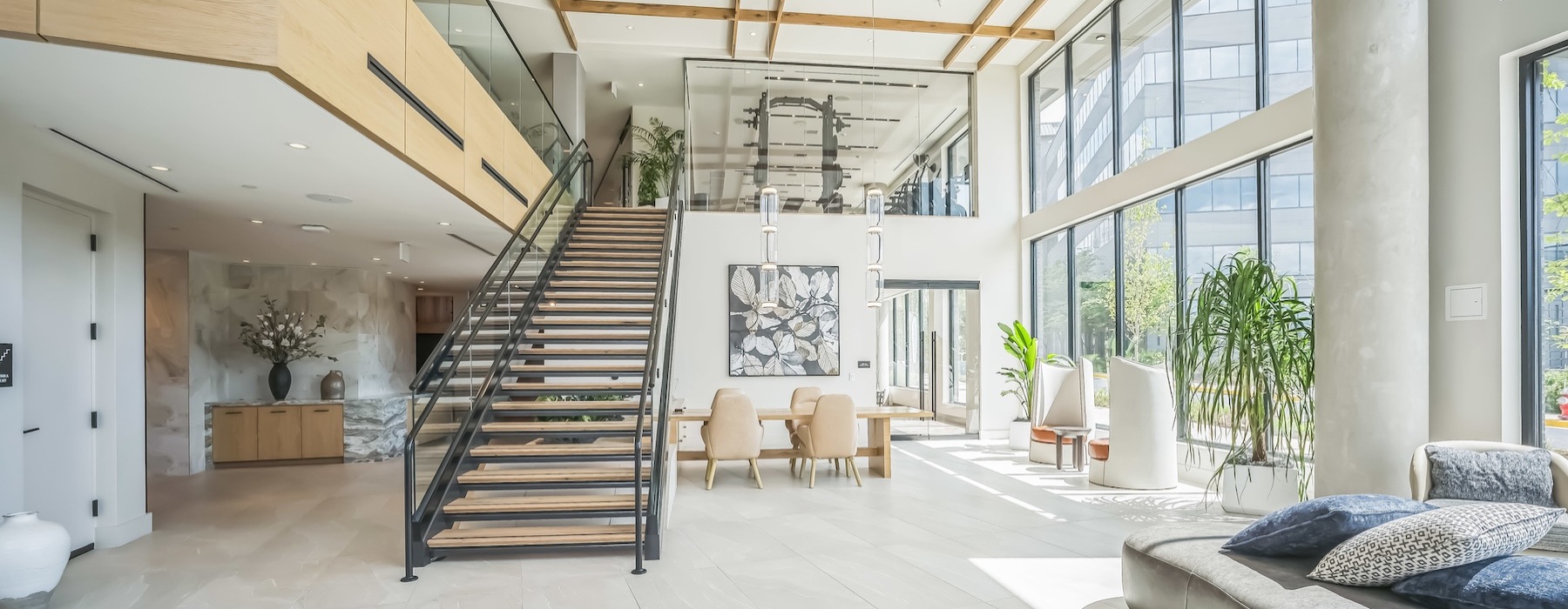 a well-lit lounge area with stairs